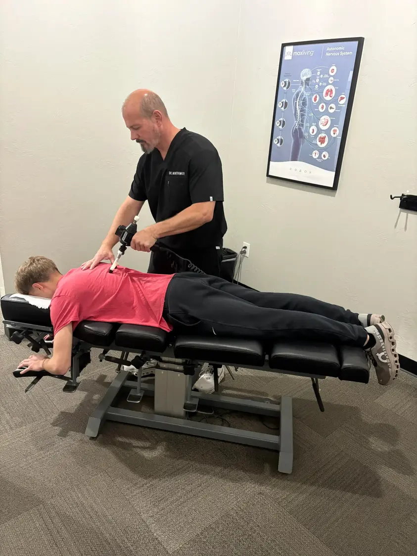 Person being adjusted at Axis Chiropractic